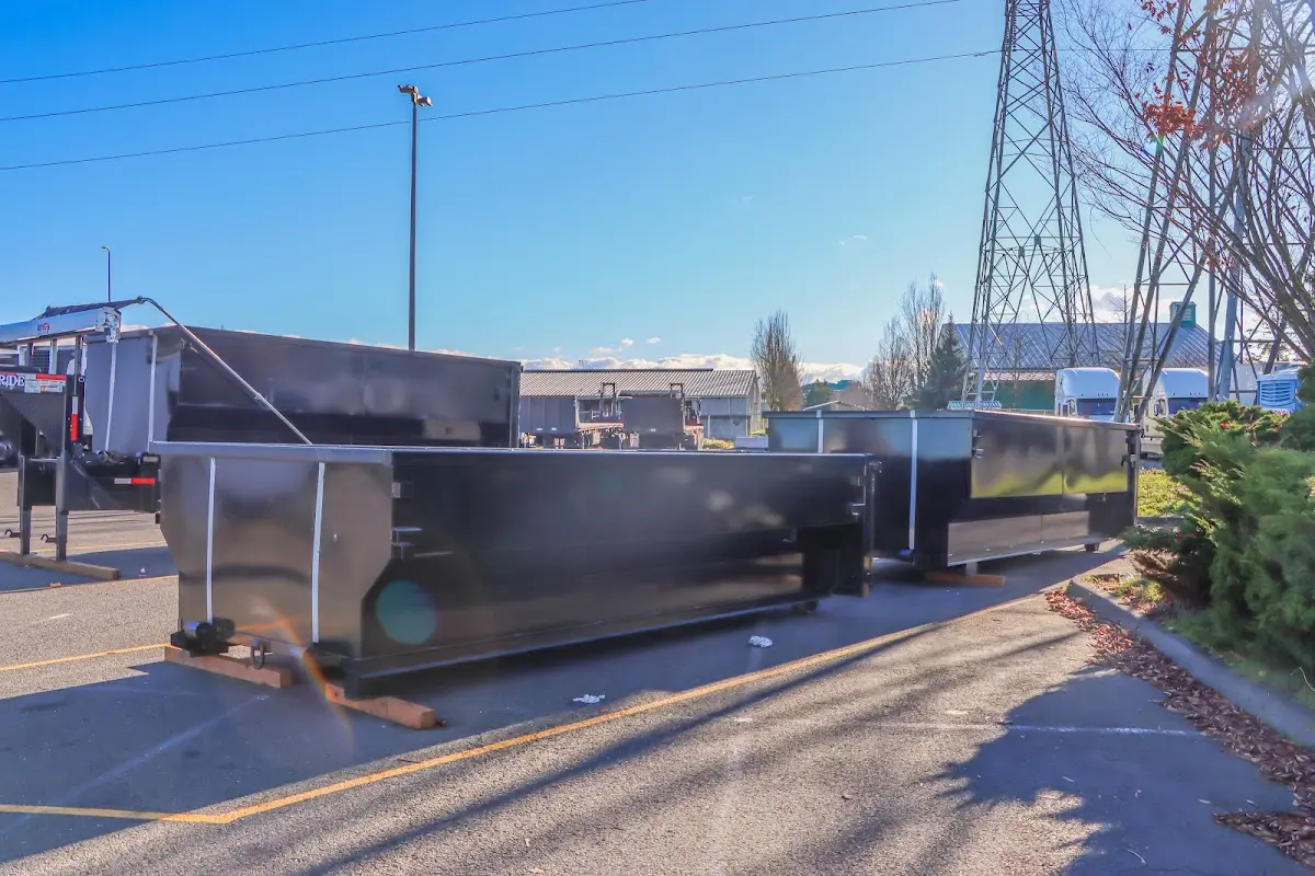 Roll-off dumpster ready for waste disposal at job site for Demolition Dumpster Rental in Prattville